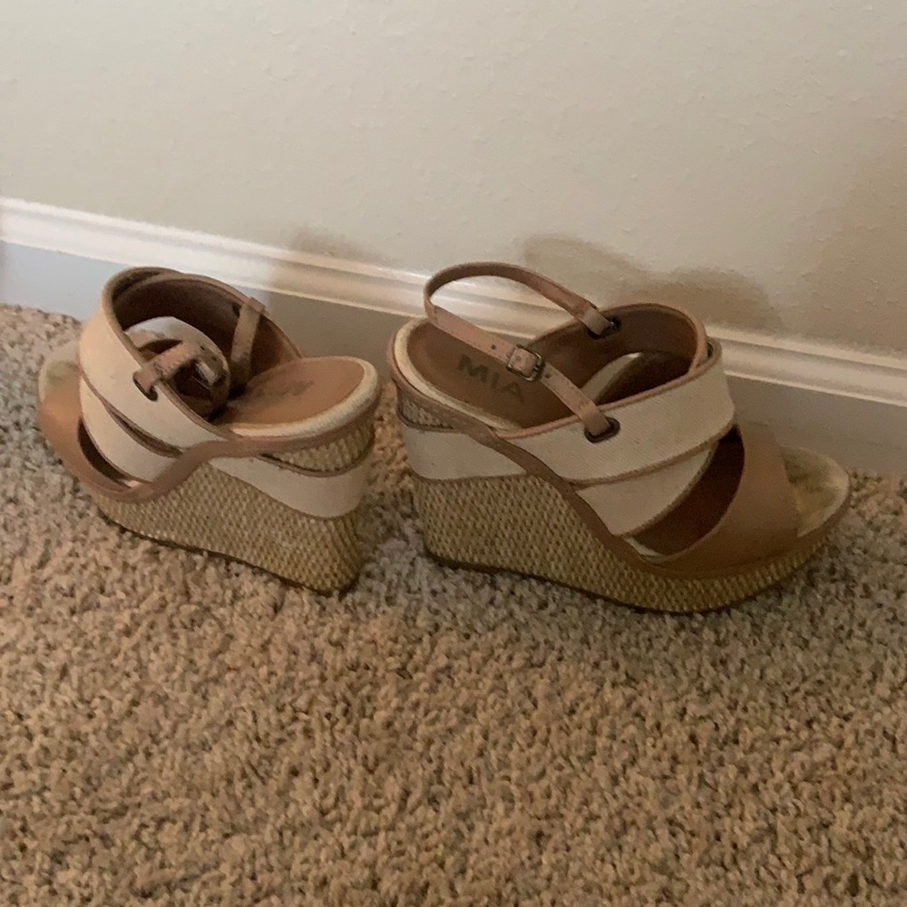 Platform cream and tan wedge sandals.
